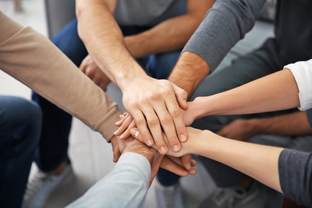 young people sitting together in group therapy young people sitting together in group therapy