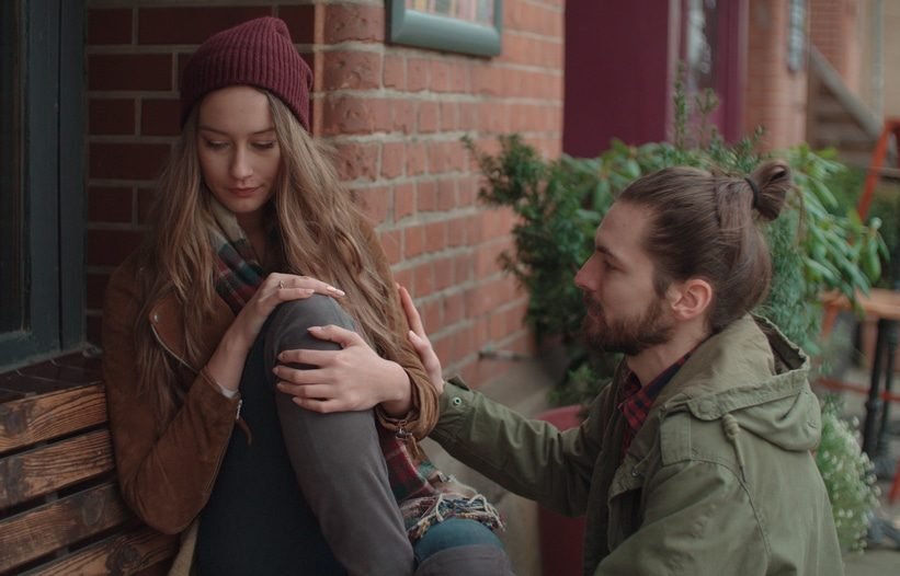 Young man comforting sad woman Young man comforting sad woman