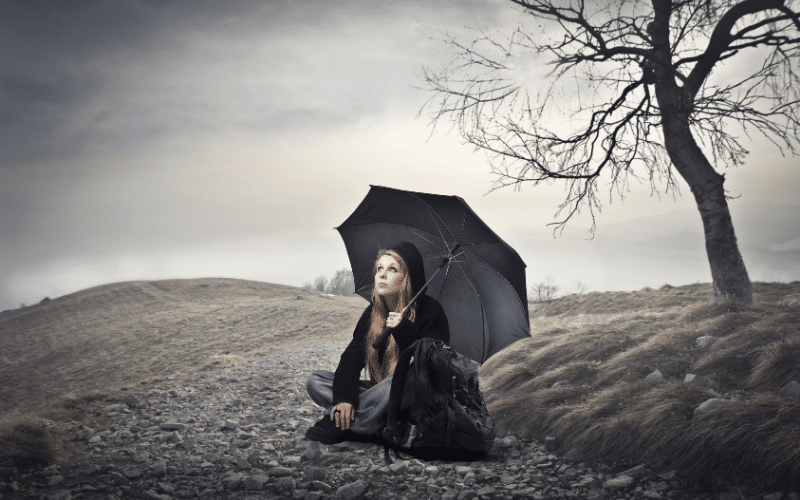 woman sitting in the rain, depressed female woman sitting in the rain, depressed female