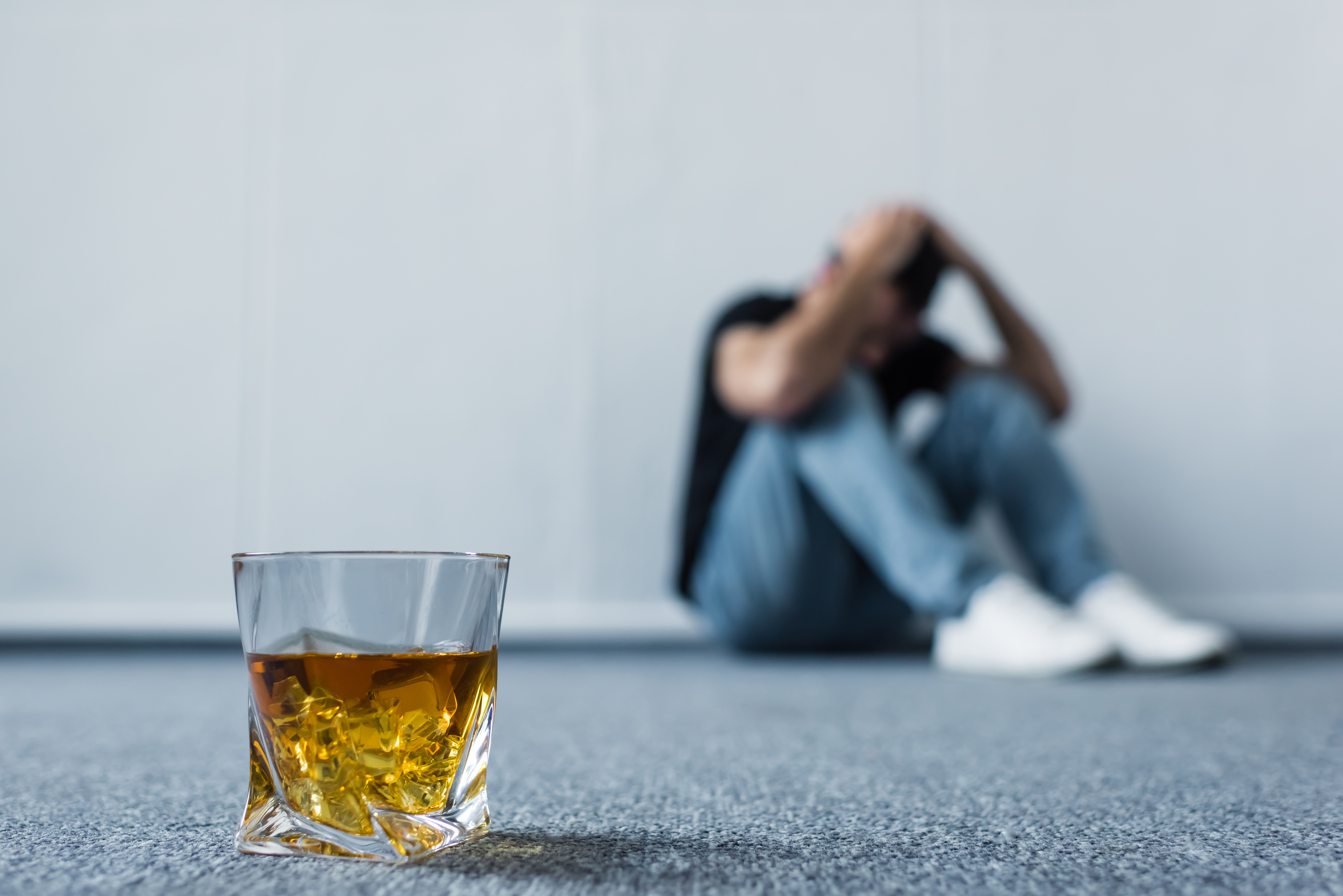Person Battling Alcohol Addiction