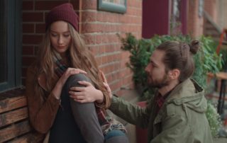 Young man comforting sad woman
